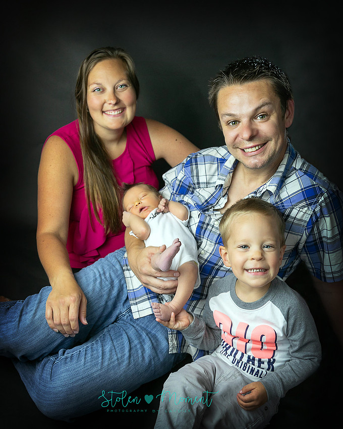 a 7 day old baby boy with his 3 year old big brother, his mom and his dad