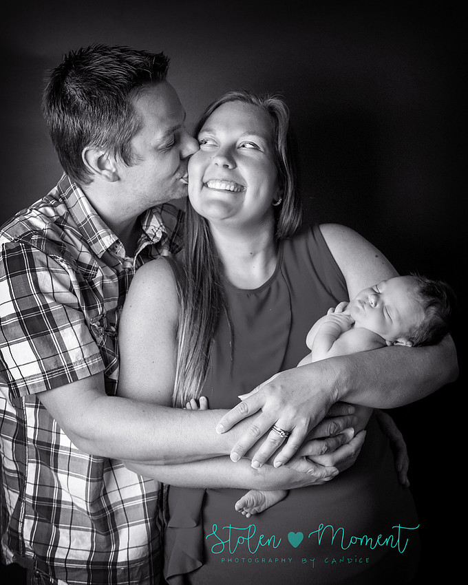 a 7 day old baby boy with his 3 year old big brother, his mom and his dad