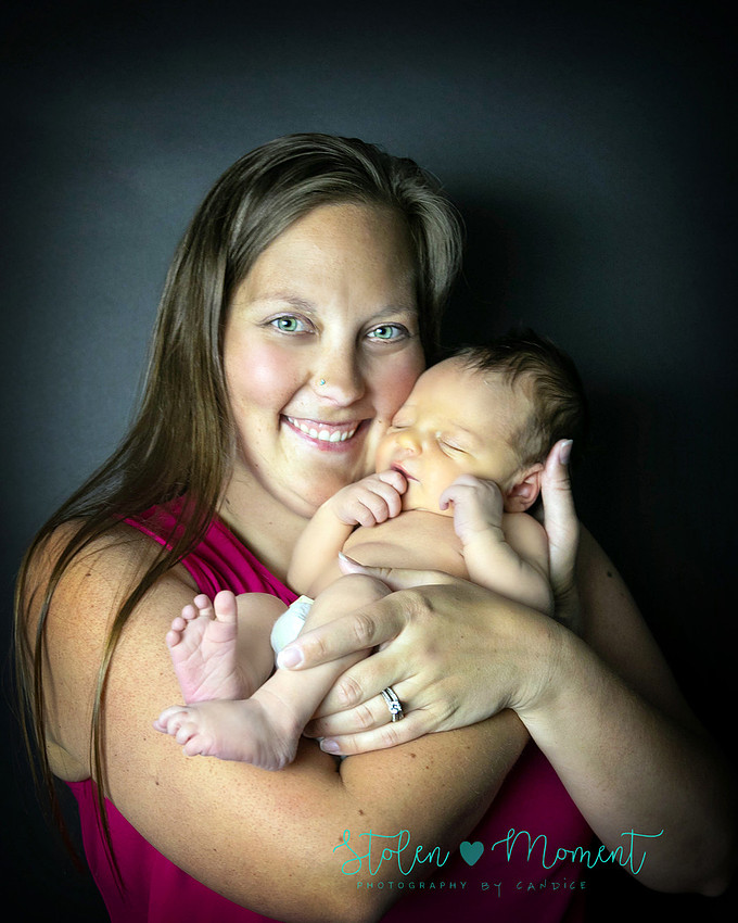 a 7 day old baby boy with his 3 year old big brother, his mom and his dad