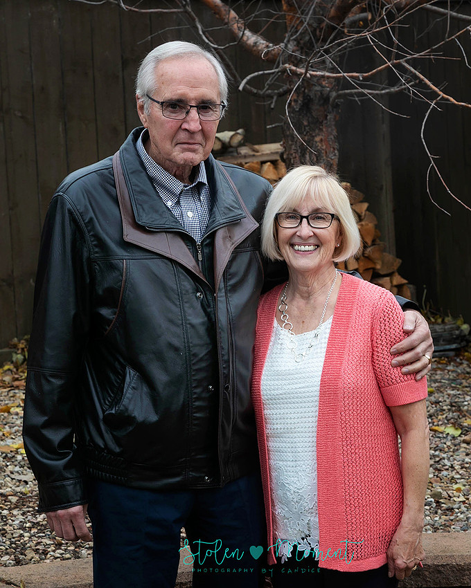 Family of fifteen photographed on a chilly fall afternoon in a Stony Plain backyard.