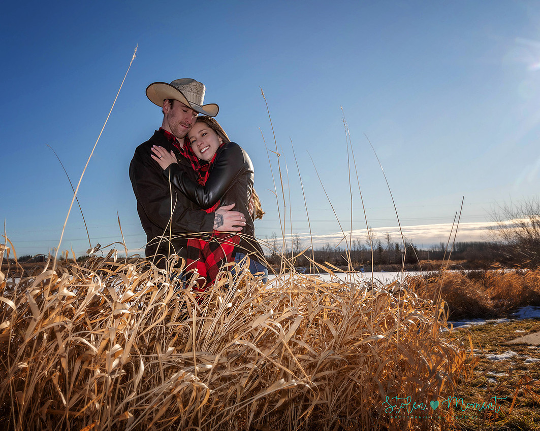 a beautiful engaged couple have their engagement photos done at Lois Hole Centennial Provincial Park