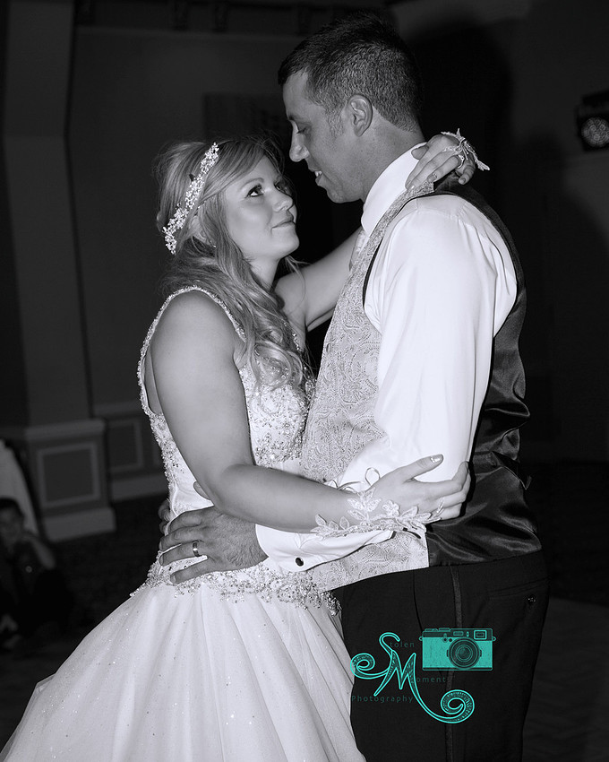 bride looks lovingly into eyes of groom during first dance